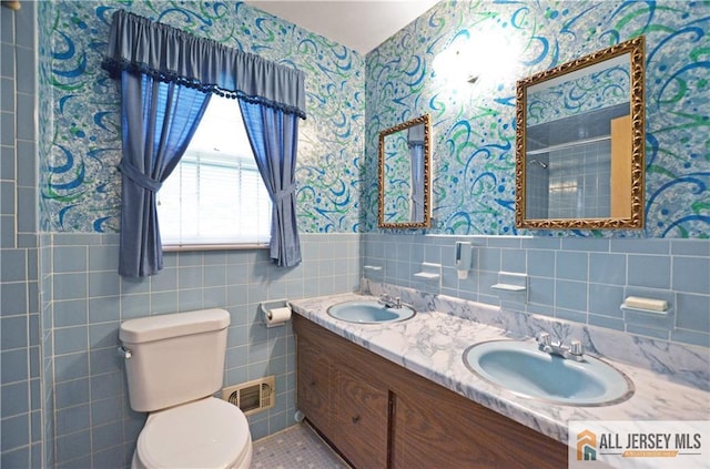 20 Rath Ln, East Brunswick, NJ 08816 - full bath featuring wallpapered walls, a wainscoted wall, double vanity, tile walls, and tiled shower