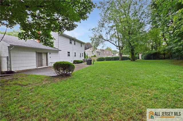 20 Rath Ln, East Brunswick, NJ 08816 - view of grassy yard with a patio area