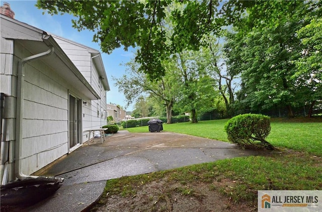20 Rath Ln, East Brunswick, NJ 08816 - view of green lawn featuring a patio area