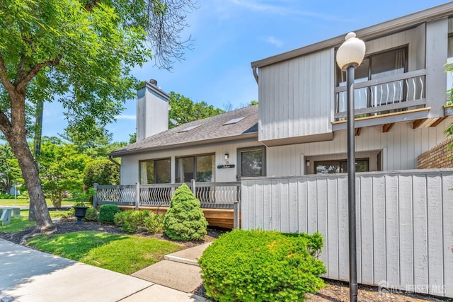 12 Arbor Ct, South Brunswick, NJ 08852 - view of front of home featuring a balcony, a chimney, and a shingled roof