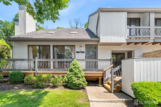 12 Arbor Ct, South Brunswick, NJ 08852 - view of front of house with roof with shingles and a chimney