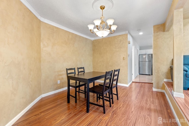 12 Arbor Ct, South Brunswick, NJ 08852 - dining space with a chandelier, wood finished floors, and crown molding