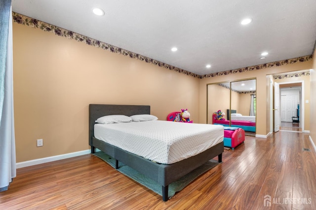 12 Arbor Ct, South Brunswick, NJ 08852 - bedroom with wood finished floors, recessed lighting, and a closet