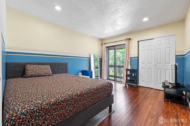 12 Arbor Ct, South Brunswick, NJ 08852 - bedroom with a textured ceiling, access to outside, wood finished floors, recessed lighting, and a closet