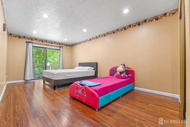 12 Arbor Ct, South Brunswick, NJ 08852 - bedroom with a textured ceiling, wood finished floors, and recessed lighting