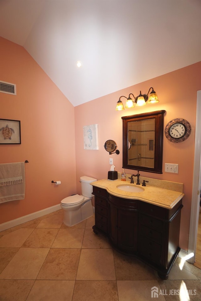 bathroom with vanity, visible vents, vaulted ceiling, tile patterned floors, and toilet