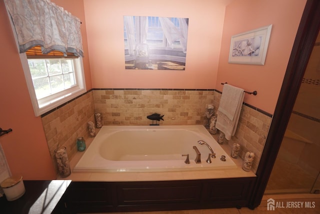 bathroom featuring a garden tub