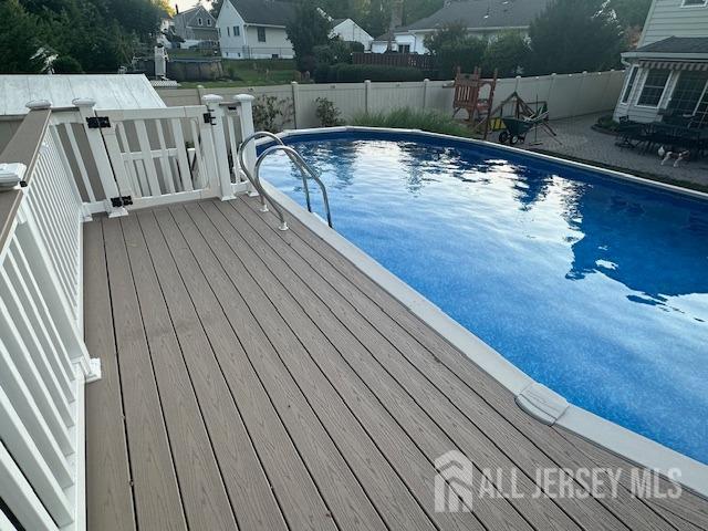 view of pool featuring a fenced in pool and a fenced backyard