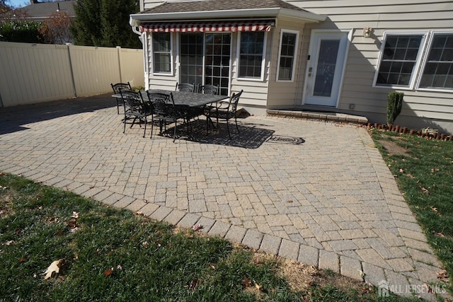 view of patio / terrace with outdoor dining space and fence