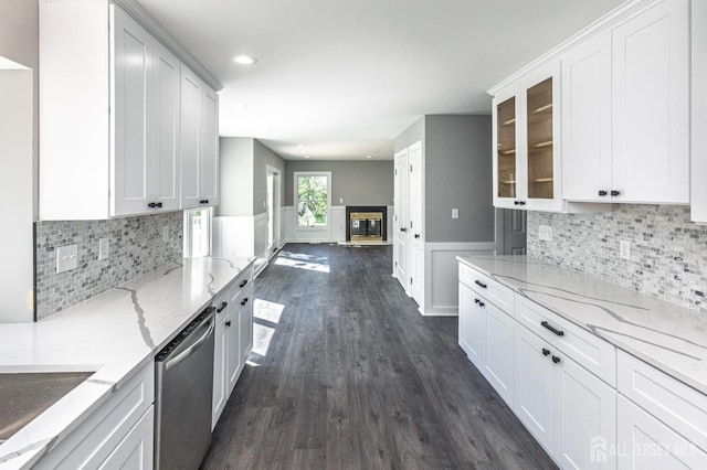 15 Pennyroyal Ct, South Brunswick, NJ 08540 - kitchen with dishwasher, dark wood finished floors, open floor plan, glass insert cabinets, and light stone counters
