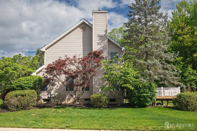 15 Pennyroyal Ct, South Brunswick, NJ 08540 - view of home's exterior featuring a chimney, a yard, and a deck