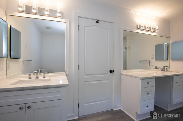 15 Pennyroyal Ct, South Brunswick, NJ 08540 - bathroom featuring vanity, wood finished floors, and crown molding