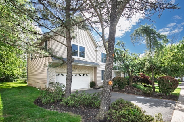 15 Pennyroyal Ct, South Brunswick, NJ 08540 - view of property exterior featuring a garage, a yard, driveway, and stone siding