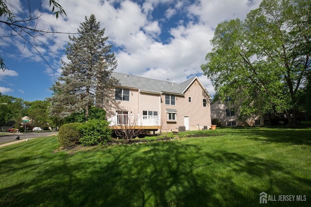 15 Pennyroyal Ct, South Brunswick, NJ 08540 - back of house featuring a lawn, a deck, and central air condition unit