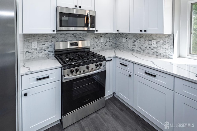 15 Pennyroyal Ct, South Brunswick, NJ 08540 - kitchen featuring appliances with stainless steel finishes, dark wood finished floors, white cabinets, and backsplash