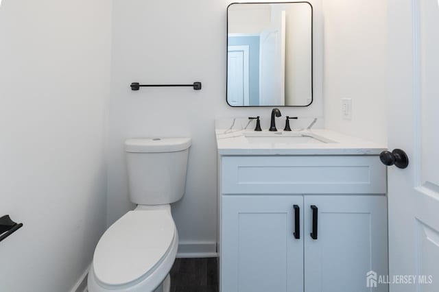 15 Pennyroyal Ct, South Brunswick, NJ 08540 - bathroom featuring toilet, vanity, and baseboards