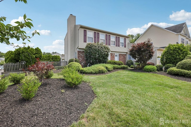 6 E Wintergreen Ave, Edison, NJ 08820 - colonial house with a chimney and brick siding