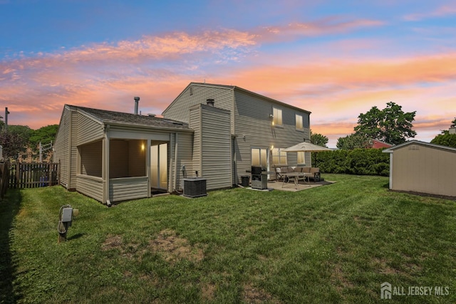6 E Wintergreen Ave, Edison, NJ 08820 - back of house with a patio area and a storage shed