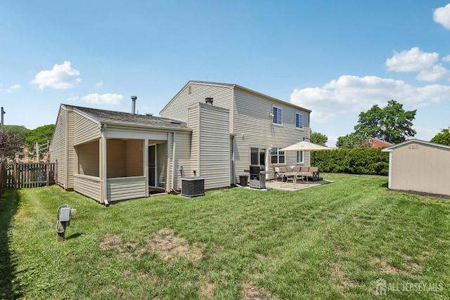 6 E Wintergreen Ave, Edison, NJ 08820 - back of house with a patio area, an outdoor living space, and a storage unit