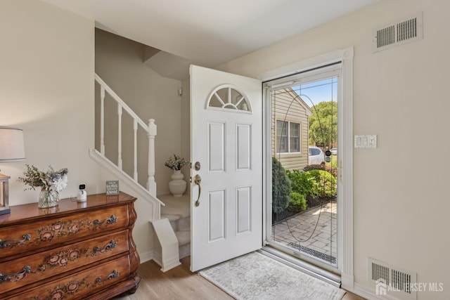 6 E Wintergreen Ave, Edison, NJ 08820 - entrance foyer with light wood-type flooring and stairs