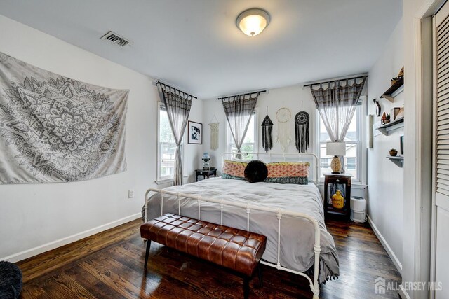 382 Highland St, South Amboy, NJ 08879 - bedroom featuring dark wood-style flooring and baseboards