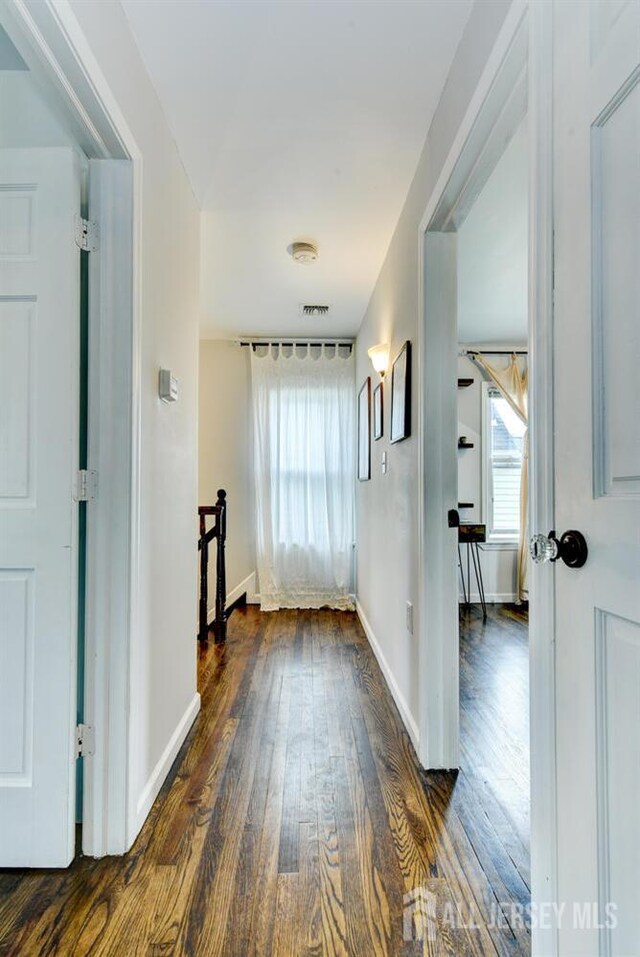 382 Highland St, South Amboy, NJ 08879 - hallway featuring hardwood / wood-style floors and an upstairs landing