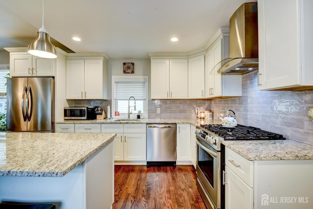 382 Highland St, South Amboy, NJ 08879 - kitchen featuring appliances with stainless steel finishes, wall chimney range hood, dark wood finished floors, tasteful backsplash, and light stone counters