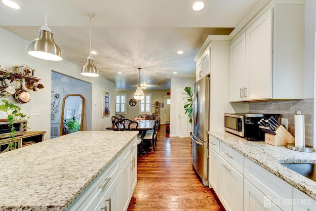 382 Highland St, South Amboy, NJ 08879 - kitchen featuring recessed lighting, wood finished floors, white cabinetry, decorative backsplash, and decorative light fixtures