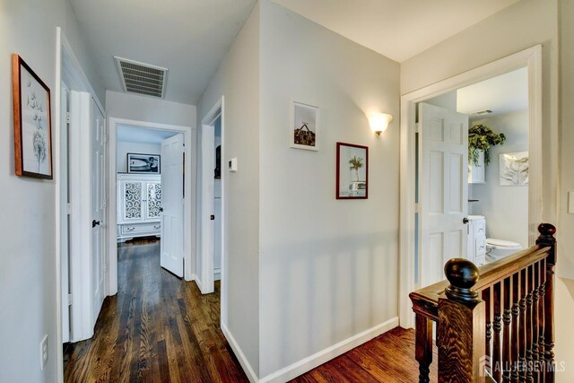 382 Highland St, South Amboy, NJ 08879 - hallway featuring dark wood-style flooring and baseboards