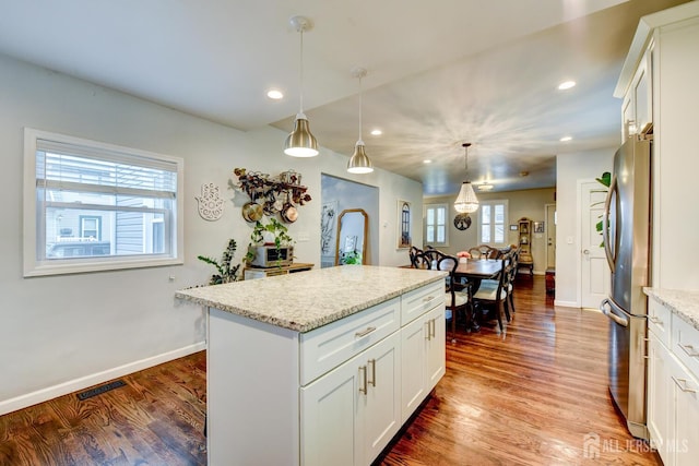 382 Highland St, South Amboy, NJ 08879 - kitchen featuring freestanding refrigerator, wood finished floors, decorative light fixtures, recessed lighting, and a kitchen island