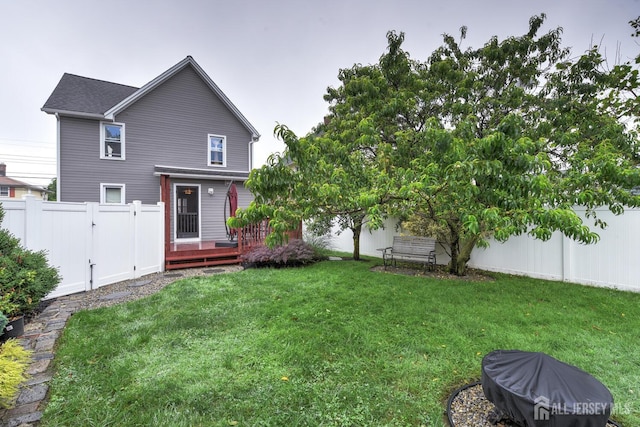 382 Highland St, South Amboy, NJ 08879 - rear view of property featuring a fenced backyard and a deck