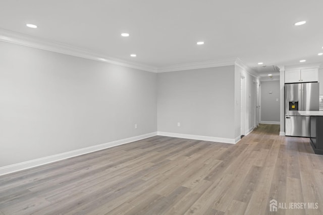 unfurnished living room featuring light hardwood / wood-style floors and ornamental molding