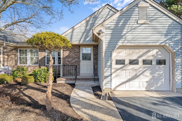 view of front of property with a garage