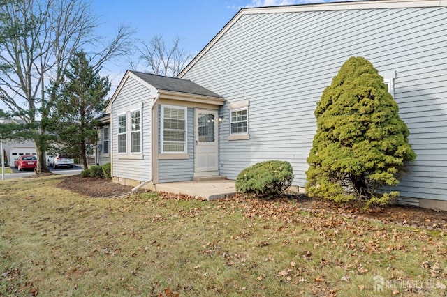 view of property exterior featuring a yard