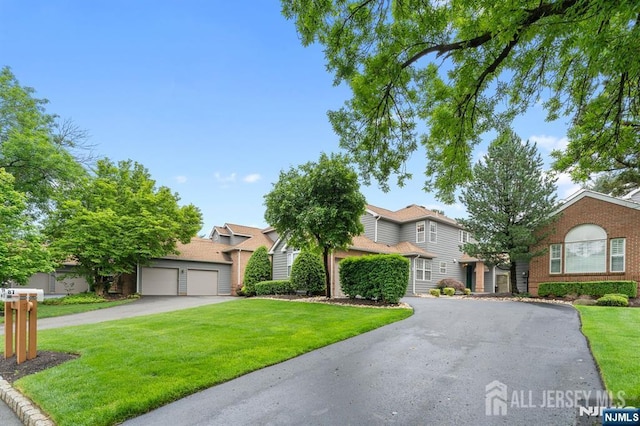 87 Fairway Blvd, Middlesex, NJ 08831 - view of property hidden behind natural elements featuring driveway, a front lawn, and brick siding