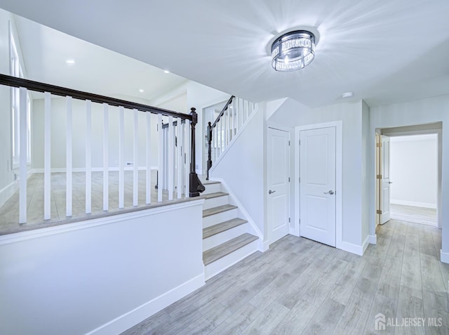 44 Sullivan Way E, Brunswick, NJ 08816 - staircase featuring wood finished floors, baseboards, and recessed lighting