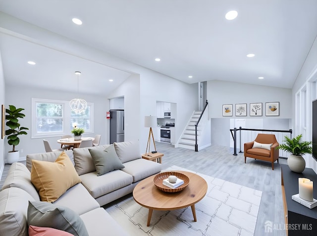 44 Sullivan Way E, Brunswick, NJ 08816 - living room featuring lofted ceiling, recessed lighting, light wood-type flooring, and stairway