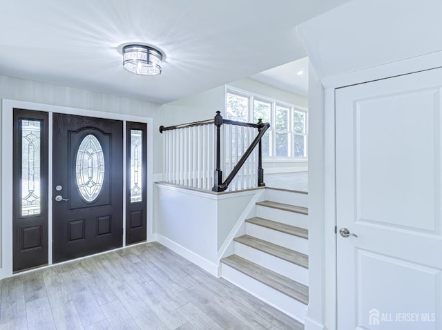 44 Sullivan Way E, Brunswick, NJ 08816 - entrance foyer with stairs, light wood-style floors, and baseboards