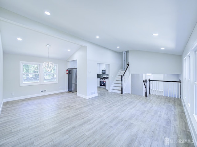 44 Sullivan Way E, Brunswick, NJ 08816 - unfurnished living room with vaulted ceiling, light wood-style floors, baseboards, and recessed lighting