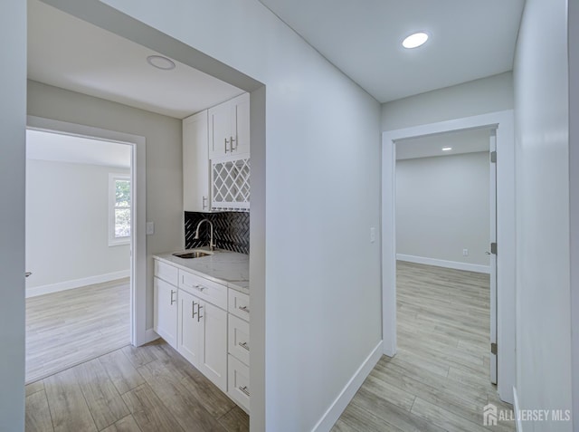 44 Sullivan Way E, Brunswick, NJ 08816 - hall featuring a sink, light wood-style floors, baseboards, and recessed lighting