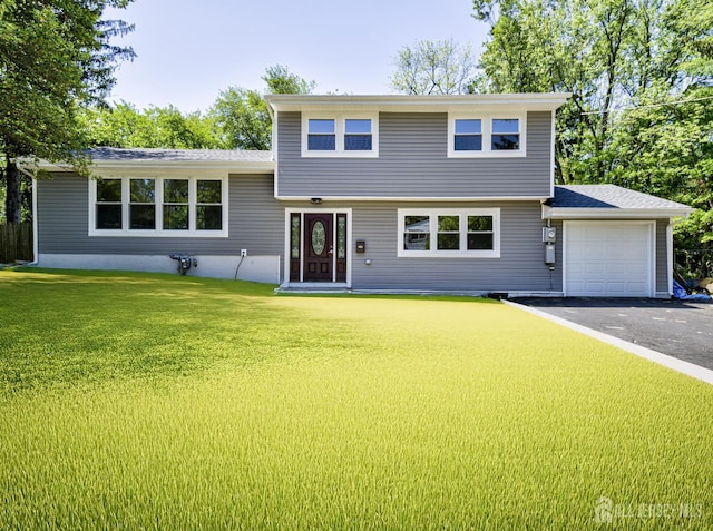 44 Sullivan Way E, Brunswick, NJ 08816 - tri-level home with an attached garage, a front lawn, and asphalt driveway