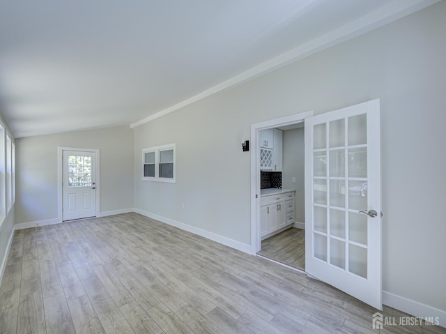 44 Sullivan Way E, Brunswick, NJ 08816 - empty room featuring lofted ceiling, light wood-style floors, and baseboards