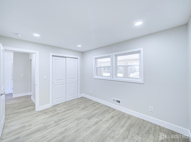 44 Sullivan Way E, Brunswick, NJ 08816 - unfurnished bedroom with baseboards, light wood-type flooring, a closet, and recessed lighting