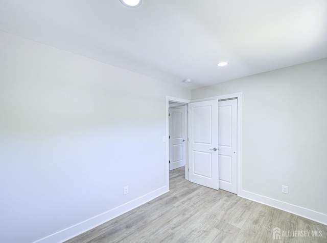 44 Sullivan Way E, Brunswick, NJ 08816 - unfurnished bedroom featuring baseboards, light wood-style flooring, recessed lighting, and a closet