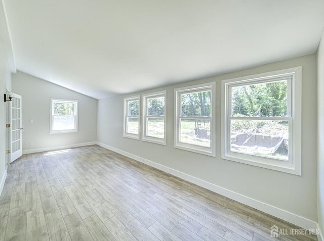 44 Sullivan Way E, Brunswick, NJ 08816 - empty room featuring baseboards, lofted ceiling, and light wood-type flooring