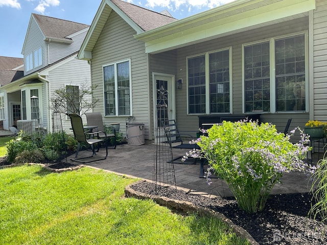 146 Aristotle Way E, Windsor, NJ 08512 - rear view of property with a lawn, a patio, roof with shingles, and entry steps