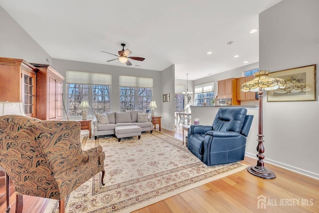 146 Aristotle Way E, Windsor, NJ 08512 - living area with a ceiling fan, light wood-style flooring, baseboards, a chandelier, and recessed lighting
