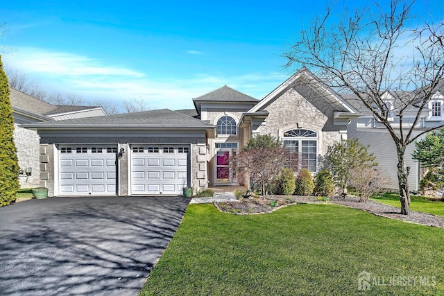 146 Aristotle Way E, Windsor, NJ 08512 - french country style house featuring an attached garage, asphalt driveway, a front yard, and stone siding