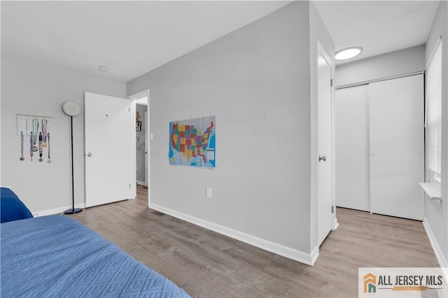 52 Lantern Ln, Sayreville, NJ 08872 - bedroom with wood finished floors and a closet
