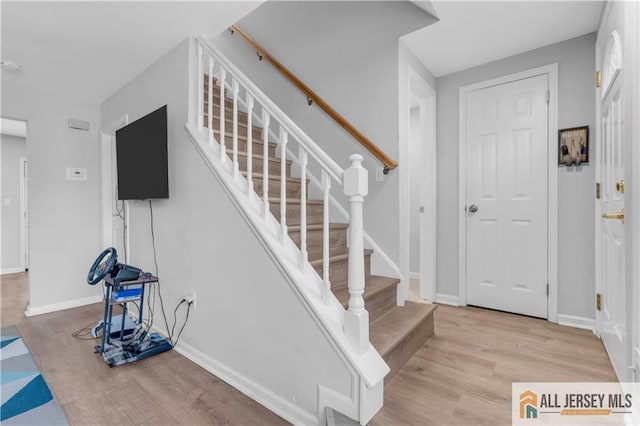52 Lantern Ln, Sayreville, NJ 08872 - staircase with wood finished floors and baseboards